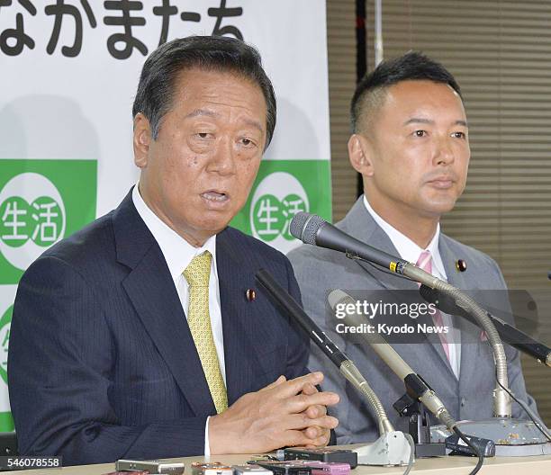 Co-leaders of People's Life Party -- Ichiro Ozawa and Taro Yamamoto -- attend a press conference in Tokyo on July 11 following voting in the upper...