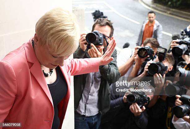 Angela Eagle, former business spokeswoman for the U.K. Opposition Labour Party, waves to photographers as she arrives for a news conference to...
