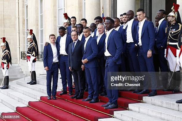 French President Francois Hollande poses with France's national football team players at the Elysee Palace on July 11, 2016 in Paris, France....