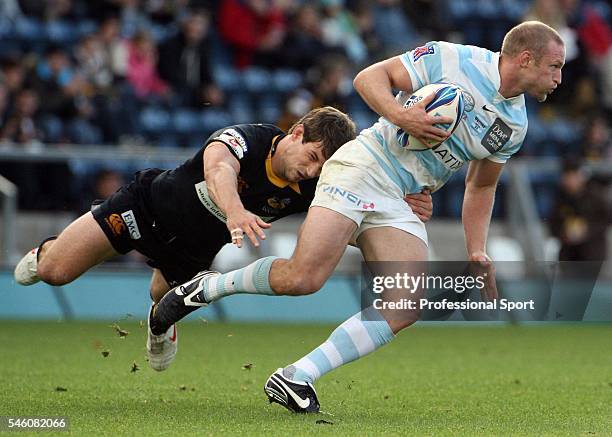 Dominic Waldouck of the Wasps tries to take down Dan Scarbrough of Racing Metro during the Amlin Challenge Cup match between London Wasps and Racing...