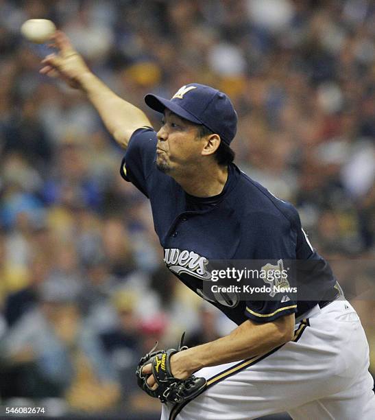 United States - Takashi Saito of the Milwaukee Brewers pitches against the Arizona Diamondbacks in MLB's National League Division Series game at...