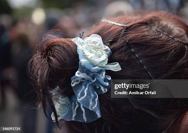 Woman wears a scrunchie with the colors of Argentinian flag at Feria de Mataderos during Argentina Bicentennial Celebrations on July 09, 2016 in...