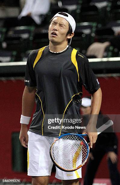 Japan - Japan's Tatsuma Ito reacts during a men's singles second round match at the Japan Open at Ariake Tennis Forest Park in Tokyo on Oct. 5, 2011....