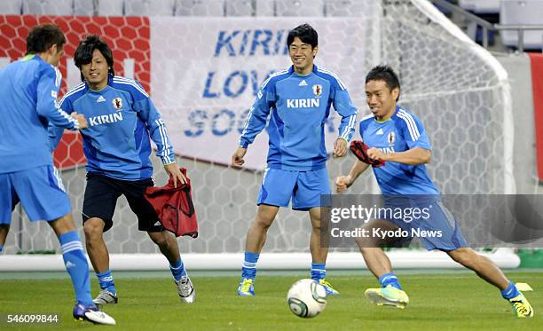 Japan - Members of the Japan national soccer team -- Yasuhito Endo, Shinji Kagawa and Yuto Nagatomo -- are seen in action during a practice session...