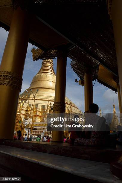 Yangon, Myanmar Looking through columns to the Shwedagon Pagoda in Yangon on June 16, 2016 in Yangon, Myanmar.