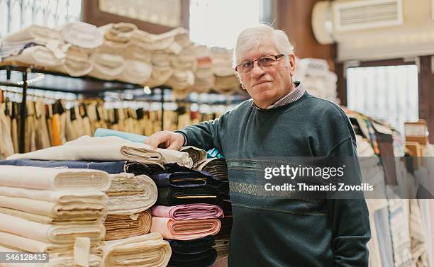 portrait of owner of fabrics store - fabric shop stock pictures, royalty-free photos & images