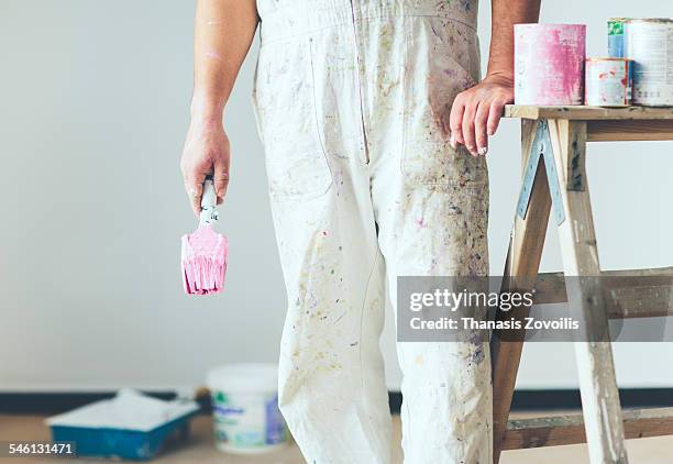 painter working in refurbishment - farbeimer stock-fotos und bilder
