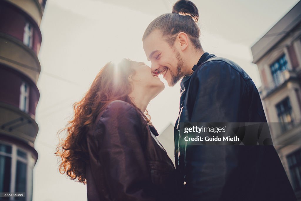 Smiling couple before kissing.