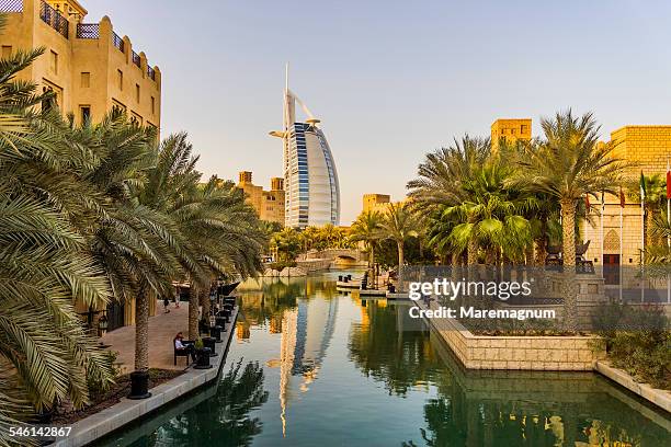 exterior of souk madinat jumeirah and burj al arab - jumeirah stock pictures, royalty-free photos & images