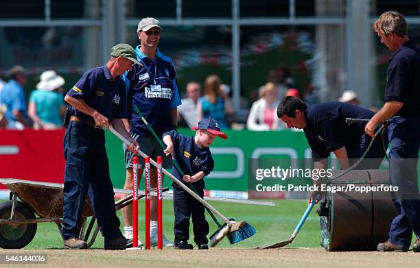 Young fan helping to sweep the pitch in between innings during the Twenty20 Cup match between Gloucestershire and Worcestershire at Bristol, 14th...