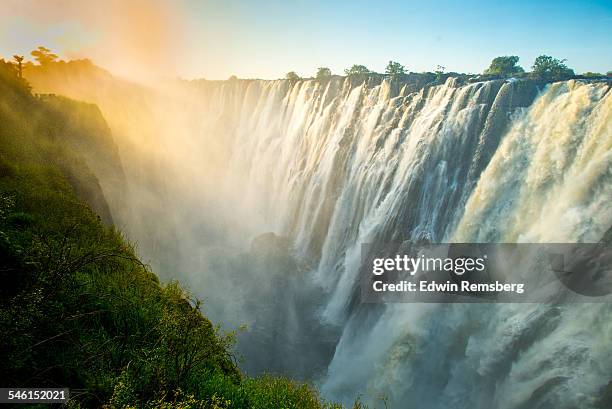 sunset haze over victoria falls - livingstone stock pictures, royalty-free photos & images