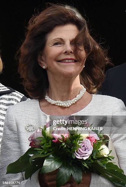 Queen Silvia of Sweden is pictured during a welcoming ceremony on July 11, 2016 at the townhall in Aachen. / AFP / dpa / Henning Kaiser / Germany OUT