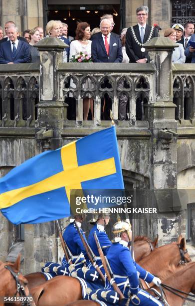 King Carl XVI Gustaf of Sweden and Queen Silvia of Sweden are pictured during a welcoming ceremony on July 11, 2016 at the townhall in Aachen. /...