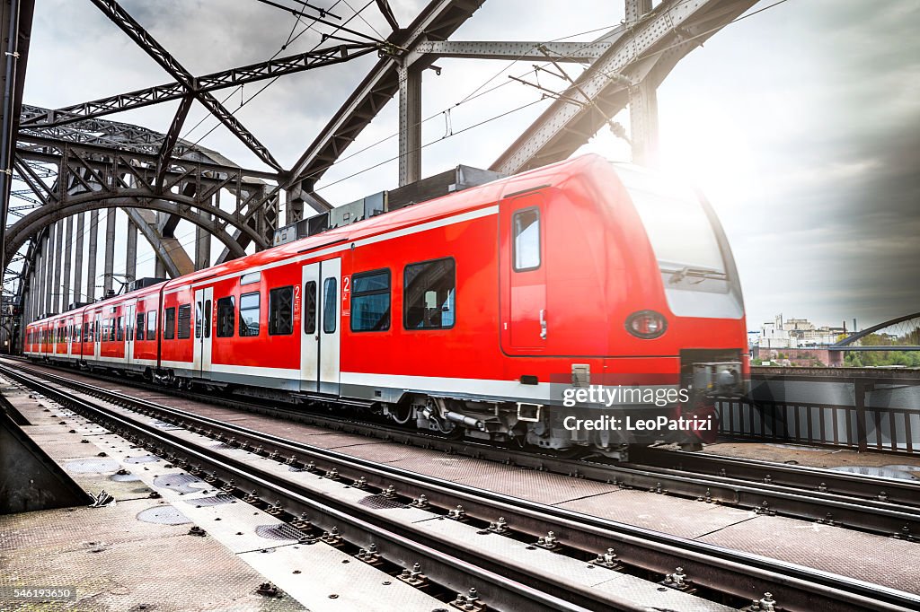 Passenger Train passing on a bridge in Frankfurt, Germany