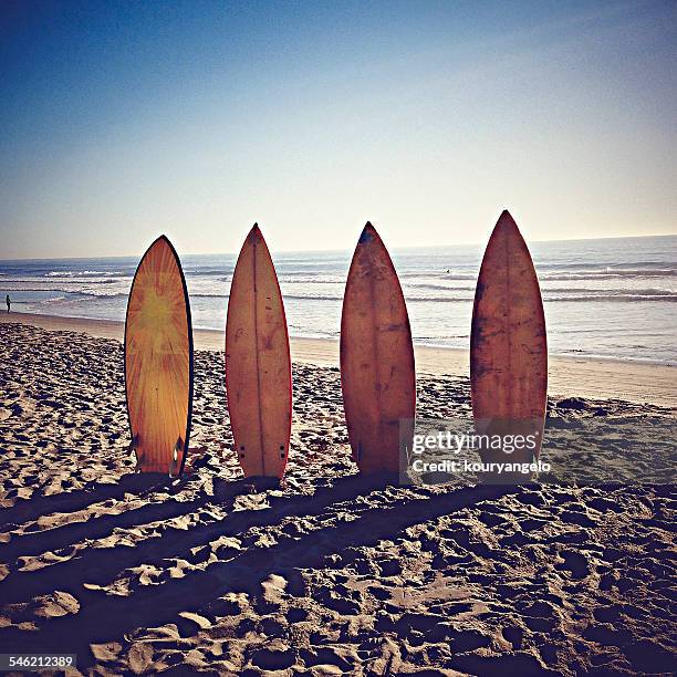 usa, california, playa del rey, surfboards on sandy beach - la four stock pictures, royalty-free photos & images