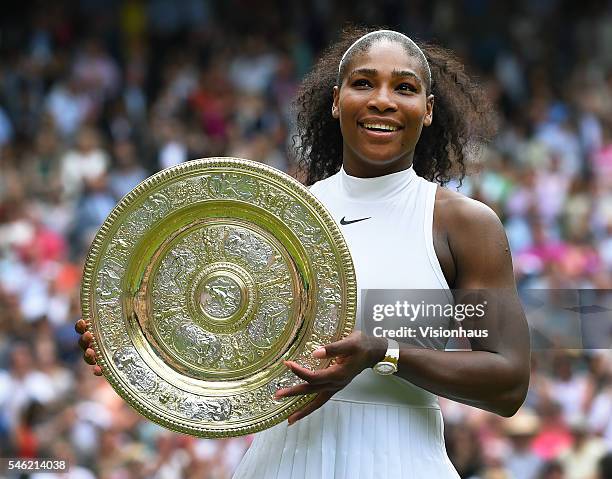 Serena Williams of USA with the trophy after winning the ladies singles final against Angelique Kerber of Germany at Wimbledon on July 9, 2016 in...