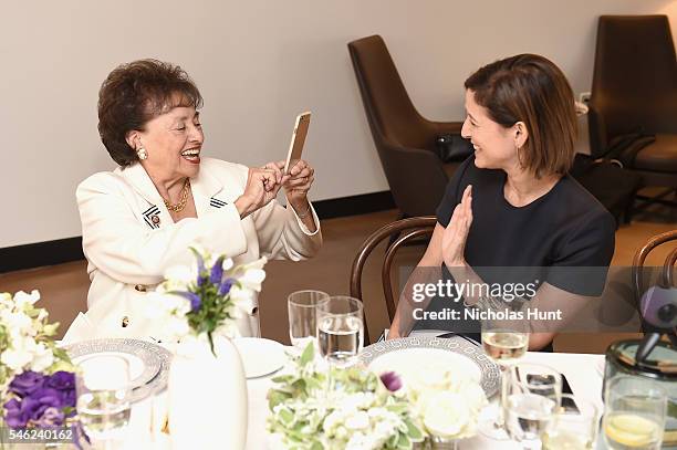 Congresswoman Nita Lowey takes a picture of Glamour editor in chief Cindi Leive during a luncheon hosted by Glamour and Facebook to discuss the 2016...