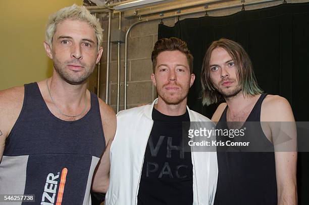 Shaun White poses with Linder designers Sam Linder and Kirk Millar backstage during the Linder Presentation at Dixon Place on July 11, 2016 in New...