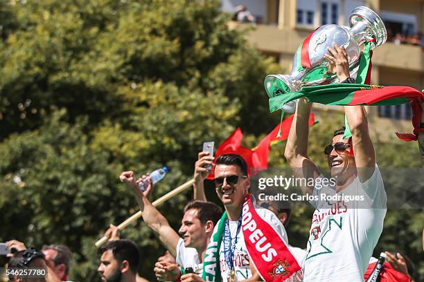 Portuguese forward Cristiano Ronaldo celebrating with the European Cup during the Portugal Euro 2016 Victory Parade at Lisbon on July 11, 2016 in...