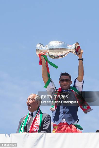 Portuguese forward Cristiano Ronaldo and Portuguese President Marcelo Rebelo de Sousa showing the European cup to the supporters during the meeting...