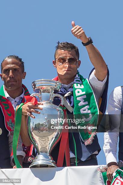 Portuguese forward Cristiano Ronaldo showing the European cup to the supporters during the meeting with the Portuguese President Marcelo Rebelo de...