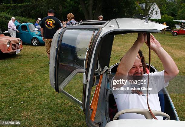 Charles Gould gives rides in his 1956 Messerschmitt KR200 Kabinenroller during the Microcar Classic Event on the lawn of the Larz Anderson Auto...