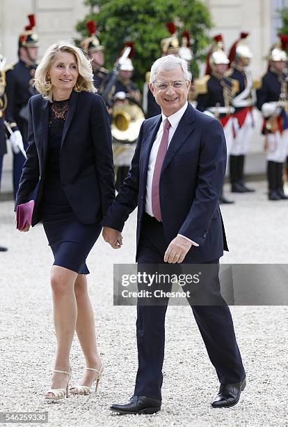 President of the French National Assembly Claude Bartolone and his wife Veronique Bartolone arrive at the Elysee Presidential Palace for a state...