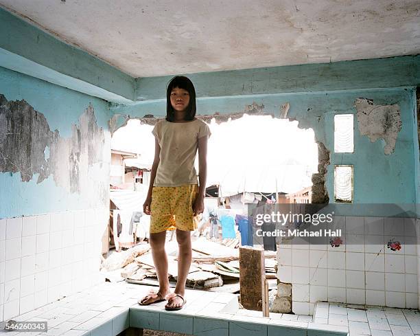 girl in damaged kitchen following typhoon - skirt stock photos et images de collection