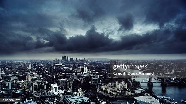 london skyine under a dark brooding sky - storm clouds stock pictures, royalty-free photos & images