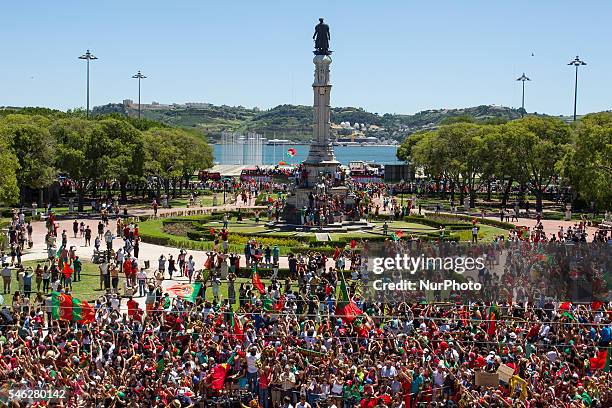 Portuguese supporters waving for the Portugal national team bus during the Portugal Euro 2016 Victory Parade at Lisbon on July 11, 2016 in Lisbon,...