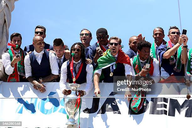 Portuguese midfielder Renato Sanches holds the European Cup and show it to the Portuguese supportes during the Portugal Euro 2016 Victory Parade at...