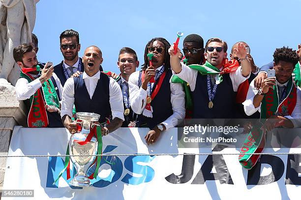 Portuguese forward Ricardo Quaresma holds the European Cup and show it to the Portuguese supportes during the Portugal Euro 2016 Victory Parade at...