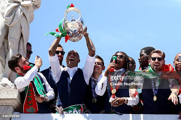 Portuguese forward Ricardo Quaresma holds the European Cup and show it to the Portuguese supportes during the Portugal Euro 2016 Victory Parade at...