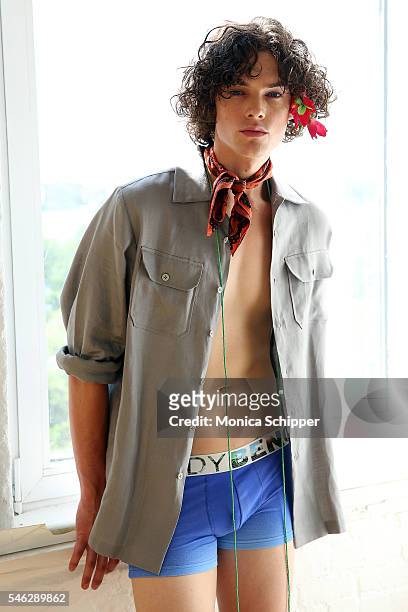 Model Max Masters poses at the Bench/Body Presentation during New York Fashion Week: Men's S/S 2017 at Michelson Studio on July 11, 2016 in New York...