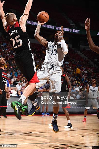 Vander Blue of Dallas Mavericks shoots the ball during the game against EJ Singler of Toronto Raptors during the 2016 Las Vegas Summer League on July...