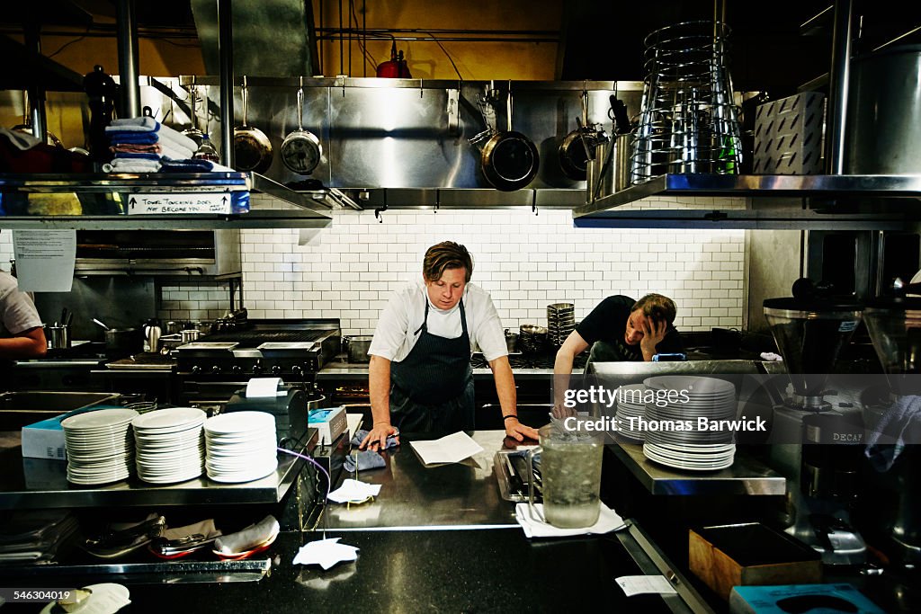 Executive chef reviewing menu with sous chef