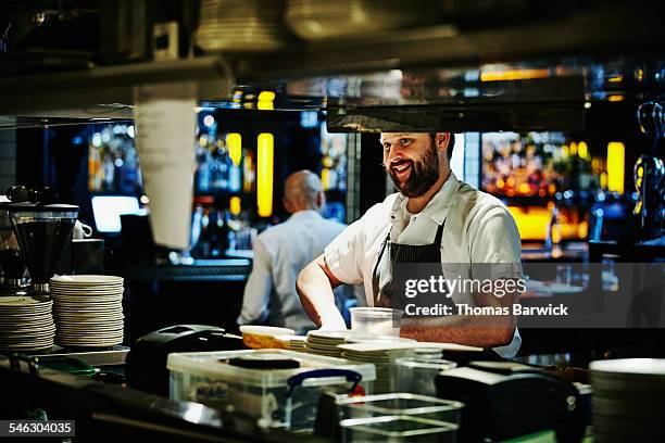 chef preparing dinner ingredients at workstation - mestiere nella ristorazione foto e immagini stock