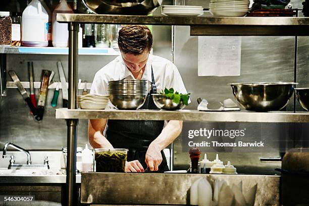 sous chef chopping ingredients for dinner service - independence bildbanksfoton och bilder