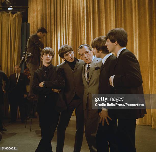 English pop group The Beatles pictured with American television host Ed Sullivan during a recording session for The Ed Sullivan Show in New York on...