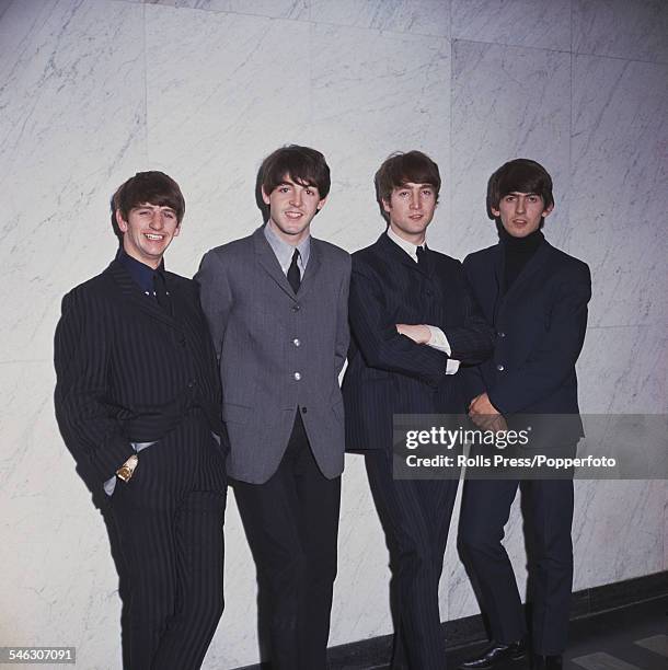 English pop group The Beatles posed standing against a wall in 1964. From left to right: Ringo Starr, Paul McCartney, John Lennon and George Harrison.