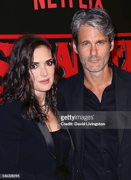 Actress Winona Ryder and Scott Mackinlay Hahn attend the premiere of Netflix's "Stranger Things" at Mack Sennett Studios on July 11, 2016 in Los...