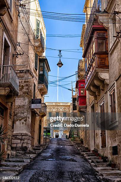 narrow streets of valetta - st julians bay stock pictures, royalty-free photos & images