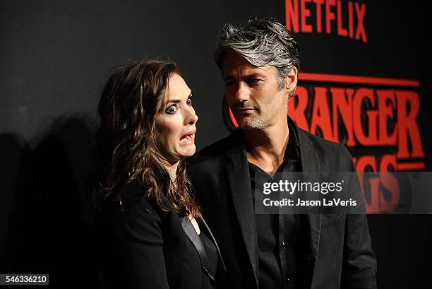 Actress Winona Ryder and Scott Mackinlay Hahn attend the premiere of "Stranger Things" at Mack Sennett Studios on July 11, 2016 in Los Angeles,...