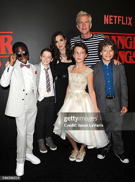 Actors Caleb McLaughlin, Noah Schnapp, Winona Ryder, Millie Bobby Brown, Matthew Modine and Gaten Matarazzo attend the premiere of "Stranger Things"...