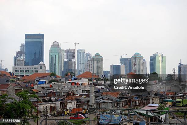 General view of skyscrapers next to the slum area in Jakarta, Indonesia, on July 11, 2016. Indonesia is the most populous country in Southeast Asia,...