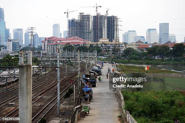 General view of skyscrapers next to the slum area in Jakarta, Indonesia, on July 11, 2016. Indonesia is the most populous country in Southeast Asia,...