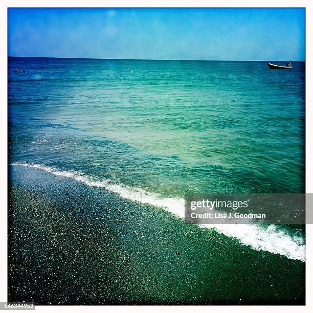 water everywhere - kamari beach stock pictures, royalty-free photos & images