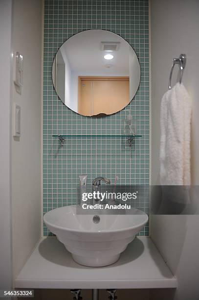 Towel, a toothbrush and a tube of toothpaste are seen in the bathroom of minimalist Saeko Kubishiki in Fujisawa, Kanagawa Prefecture in the southern...