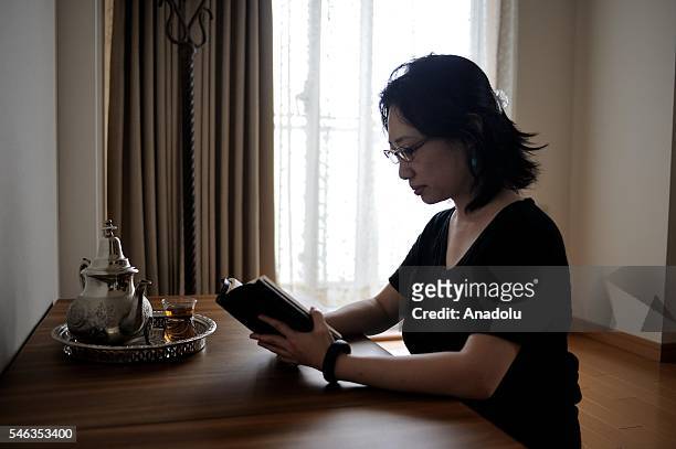 Minimalist Saeko Kubishiki reads a book in her room in Fujisawa, Kanagawa Prefecture in the southern of Tokyo, Japan, on June 29, 2016. Saeko...