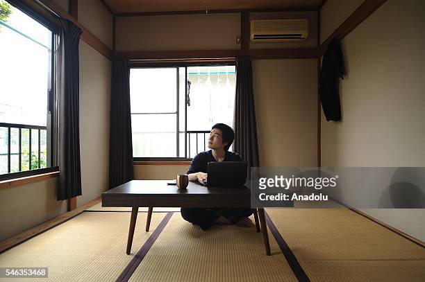 Minimalist Katsuya Toyoda sits in a tatami room at his appartment in Tokyo, Japan, on July 02, 2016. Katsuya Toyoda, an online publication editor,...
